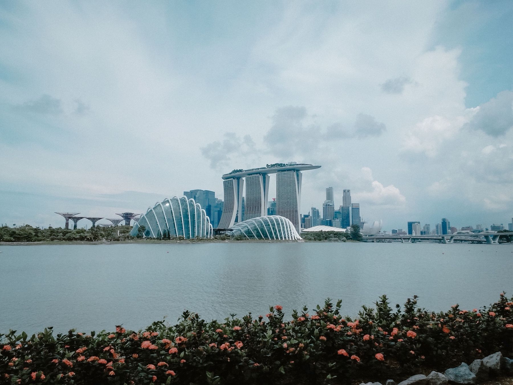 Marina Bay Sands and the garden domes across the bay on a bright day