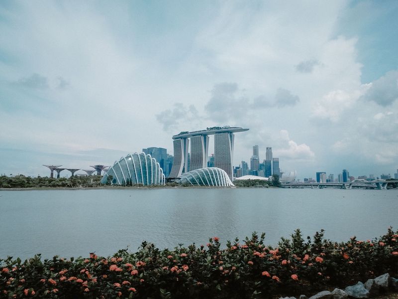 Marina Bay Sands and the garden domes across the water on a bright day