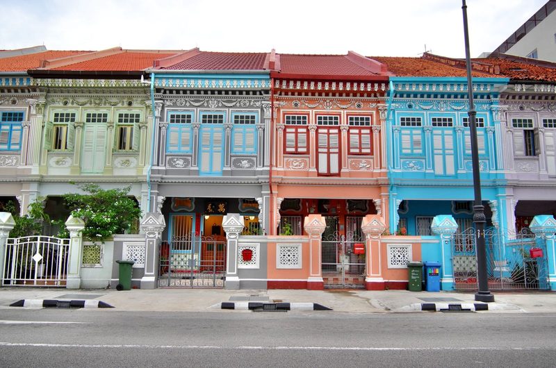 Vibrant Peranakan-style shophouses in Joo Chiat, showcasing architectural heritage and colorful facades.