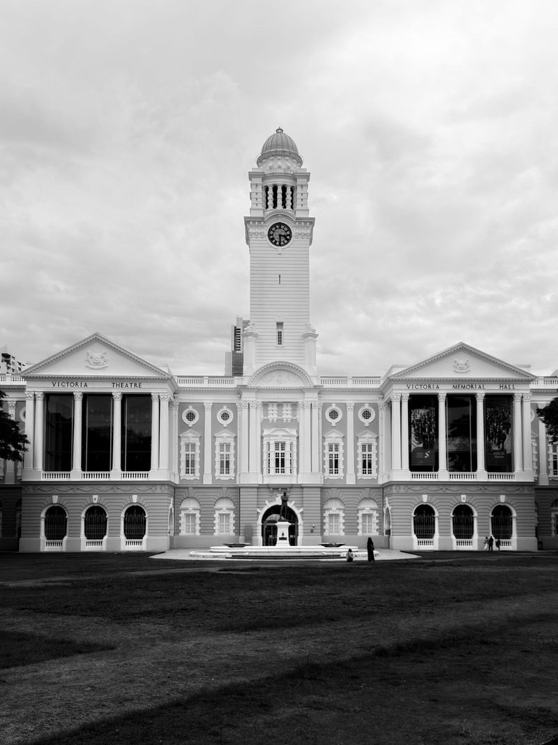 Black and white photo of Victoria Memorial Hall, showcasing Singapore's historic architecture.