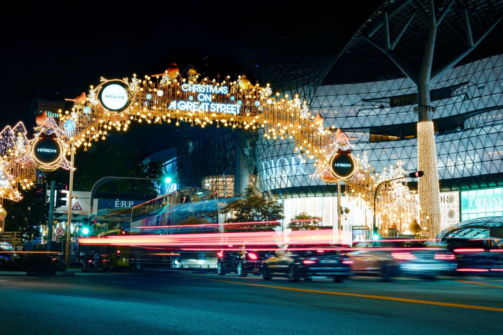 Orchard Road adorned with vibrant Christmas lights displaying 'Christmas on a Great Street'.