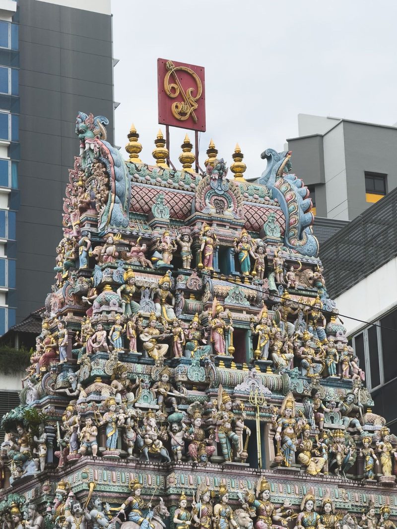 Detailed view of the intricate sculptures on Sri Mariamman Temple, a prominent Hindu temple in Singapore.