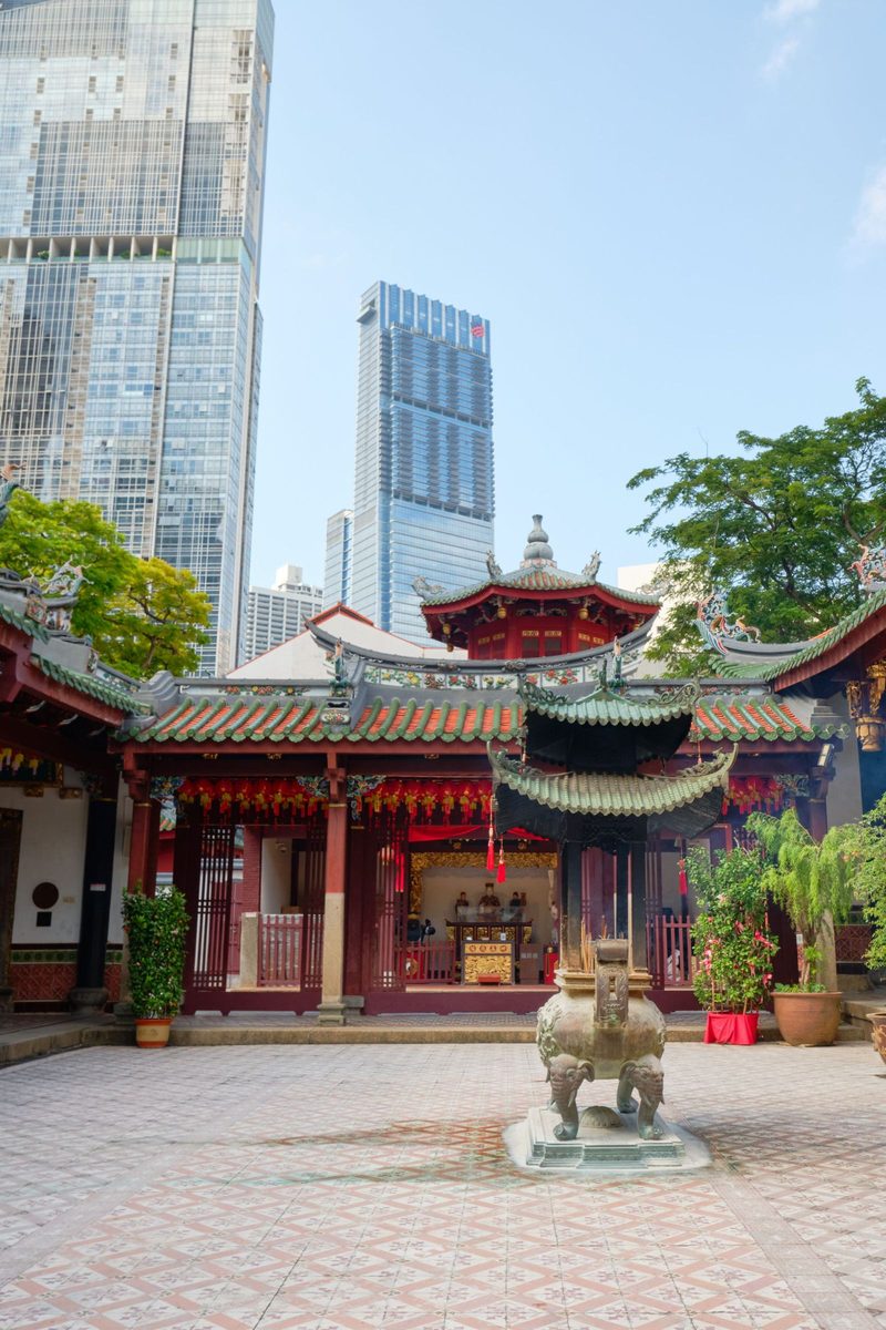 Beautiful contrast between historic Chinese temple and modern skyscrapers.