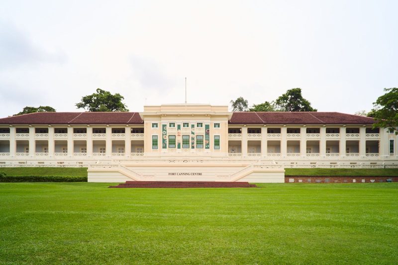 This historic Fort Canning Centre in Singapore exudes colonial elegance amidst lush green surroundings.