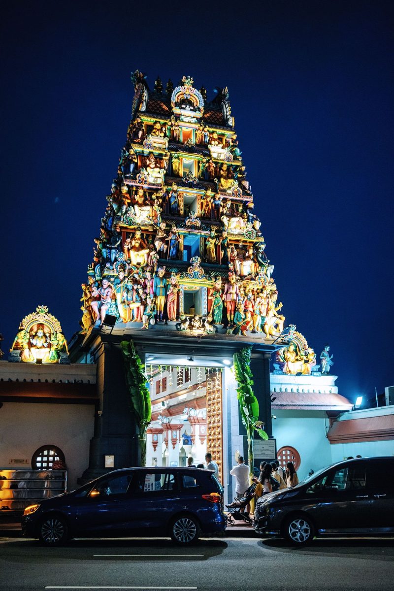Vibrant night view of the iconic Sri Mariamman Temple, Singapore's oldest Hindu temple.